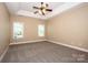 Spacious bedroom with carpeted floors and ceiling fan at 131 Quail Haven Dr, Troutman, NC 28166
