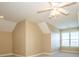 Bonus room with window and ceiling fan at 131 Quail Haven Dr, Troutman, NC 28166