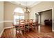 Formal dining room with hardwood floors and chandelier at 131 Quail Haven Dr, Troutman, NC 28166
