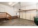 Attached garage with extra storage shelving and stairs to upper level at 131 Quail Haven Dr, Troutman, NC 28166