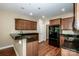 Kitchen with granite countertops and wooden cabinets at 131 Quail Haven Dr, Troutman, NC 28166