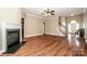 Spacious living room with hardwood floors and fireplace at 131 Quail Haven Dr, Troutman, NC 28166