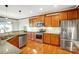 Modern kitchen featuring stainless steel appliances and wood cabinets at 136 Kingston Dr, Mount Holly, NC 28120