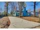 Front view of a charming blue house with a long driveway at 2515 Dion Ave, Charlotte, NC 28212