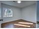 Spacious bedroom with hardwood floors and large window at 2515 Dion Ave, Charlotte, NC 28212