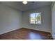 Bright bedroom with hardwood floors and window view at 2515 Dion Ave, Charlotte, NC 28212