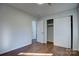 Bedroom with hardwood floors and access to another room at 2515 Dion Ave, Charlotte, NC 28212