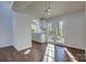 Bright dining room with hardwood floors and kitchen access at 2515 Dion Ave, Charlotte, NC 28212