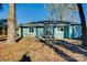 Backyard view of a blue house with patio at 2515 Dion Ave, Charlotte, NC 28212