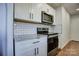 Modern kitchen with granite countertops and white cabinets at 2515 Dion Ave, Charlotte, NC 28212