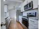 Modern kitchen with stainless steel appliances and hardwood floors at 2515 Dion Ave, Charlotte, NC 28212
