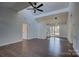 Open concept living room with hardwood floors, kitchen and french doors at 2515 Dion Ave, Charlotte, NC 28212