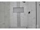 Modern shower with marble and mosaic tile at 2515 Dion Ave, Charlotte, NC 28212