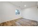 Bright bedroom featuring hardwood floors and a large window at 3035 Fallswood Dr, Gastonia, NC 28052