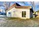 Contemporary home with a light beige exterior and metal roof at 3035 Fallswood Dr, Gastonia, NC 28052