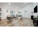 Spacious living room with hardwood floors, ample natural light, and comfortable seating at 3035 Fallswood Dr, Gastonia, NC 28052