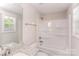 Clean bathroom featuring a bathtub, shower, and granite countertop at 358 Camden Nw Ct, Concord, NC 28027