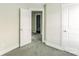 Bedroom with carpeted floors, neutral walls, and a door to the bathroom at 358 Camden Nw Ct, Concord, NC 28027
