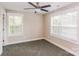 Bright bedroom with neutral walls, carpet, and two large windows at 358 Camden Nw Ct, Concord, NC 28027
