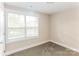 Bright bedroom with carpeted floor, neutral walls, and large window at 358 Camden Nw Ct, Concord, NC 28027