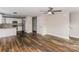 Modern kitchen with white cabinets, granite countertops, and stainless steel appliances at 358 Camden Nw Ct, Concord, NC 28027