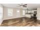 Open living and kitchen area with hardwood floors and modern kitchen at 358 Camden Nw Ct, Concord, NC 28027