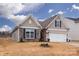 Two-story house with a neutral color scheme and landscaping at 4471 Dover Ct, Denver, NC 28037