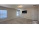 Well-lit bedroom with two windows and door at 534 Silers Bald Dr, Fort Mill, SC 29715