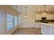 Bright dining area with wood-look flooring and access to backyard at 534 Silers Bald Dr, Fort Mill, SC 29715