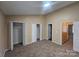 Main bedroom with carpet, double closets, and access to hallway bath at 5385 Magnolia Tree Ln, Charlotte, NC 28215