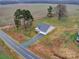 Single-story house on a large lot with a gravel driveway at 6419 Old Pageland Marshville Rd, Marshville, NC 28103