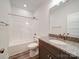 Small bathroom with a shower/tub combo and gray vanity at 6419 Old Pageland Marshville Rd, Marshville, NC 28103