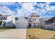 Two-story house with white siding, gray stone accents, and a two-car garage at 8398 Acadia Pkwy # 350, Sherrills Ford, NC 28673