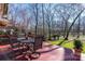 Relaxing deck overlooks a wooded backyard, perfect for outdoor dining at 13101 Whisper Creek Dr, Charlotte, NC 28277