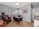 Bright home office features a comfortable leather chair and a large desk at 13101 Whisper Creek Dr, Charlotte, NC 28277