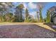 Landscaped backyard with mature trees and open space at 1410 Deborah Cir, Shelby, NC 28150