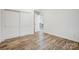 Simple bedroom with wood floors and access to living room at 1410 Deborah Cir, Shelby, NC 28150