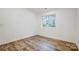 Empty bedroom featuring wood flooring and a window at 1410 Deborah Cir, Shelby, NC 28150