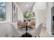Bright dining room with a wooden table and four beige chairs at 1410 Deborah Cir, Shelby, NC 28150