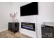 Modern electric fireplace with sleek black surround and mantel at 1410 Deborah Cir, Shelby, NC 28150