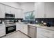 Modern kitchen with stainless steel appliances and white cabinets at 1410 Deborah Cir, Shelby, NC 28150