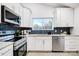 Modern kitchen with stainless steel appliances and a stylish backsplash at 1410 Deborah Cir, Shelby, NC 28150