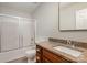 Clean bathroom with granite countertops, wooden cabinets, and a shower/tub combo at 14113 Arbor Ridge Dr, Charlotte, NC 28273