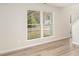 Bright living room with large window and wood-look flooring at 14113 Arbor Ridge Dr, Charlotte, NC 28273