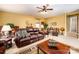 Bright bonus room with leather couches and a large window at 15705 Seafield Ln, Huntersville, NC 28078