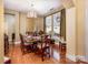 Elegant dining room featuring hardwood floors and large windows at 15705 Seafield Ln, Huntersville, NC 28078