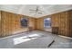 Simple bedroom with wood paneling, carpet, and two windows at 1899 Holland Rd, Rock Hill, SC 29732