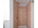 Close-up of a tiled shower with brushed nickel fixtures at 208 Oakland Dr, Lowell, NC 28098