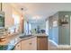 Kitchen with granite countertops, white cabinets, and island at 2800 Churn Ct, Monroe, NC 28110