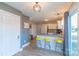 Kitchen with granite countertops, white cabinets and yellow stools at 2800 Churn Ct, Monroe, NC 28110